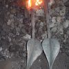 Hand forged wrought iron leaves in fire